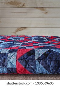 Blue And Red Folded Patchwork Quilt With Hand Quilting