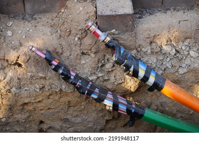 Blue, Red, Green And Orange Colored Fiber Optic Cables Laid In The Ground, Underground Cables For Faster Internet In Rural Regions, Garbsen Berenbostel, Lower Saxony, Germany.