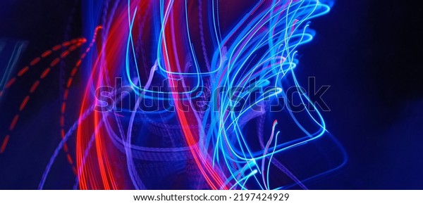 Blue and red light painting photography, long
exposure ripples and waves pattern against a black background.
Light trails long exposure highway. Blue and gold light painting
photography, long exposure