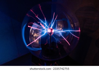 Blue and red rays from a plasma sphere in the dark. Science and Cosmos Museum. Tenerife, Canary Islands, Spain