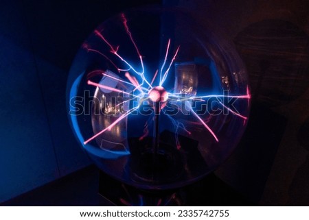 Blue and red rays from a plasma sphere in the dark. Science and Cosmos Museum. Tenerife, Canary Islands, Spain