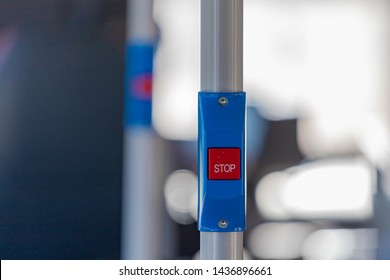 Blue and red stop button for bus or tram, Press the button to request the bus driver for get off at the next station, Public transport transfer.