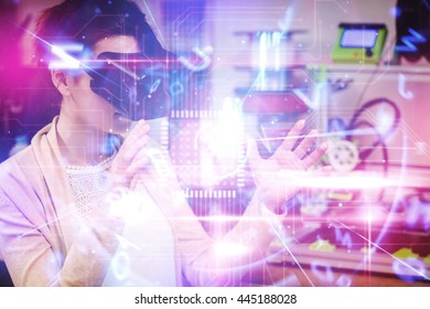 Blue and red technology interface against female graphic designer using the virtual reality headset