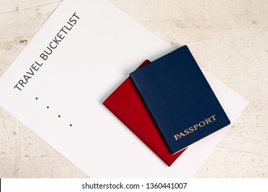 Blue And Red Travel Passports On A Light Background, Next To The Inscription Travel Bucketlist