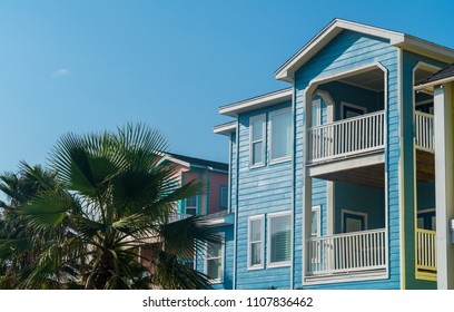 Blue Rental Home Port Aransas , Texas Padre Island Coastal Homes Along Gulf Of Mexico Island Living. Rental And Vacation Homes Painted Bright Colorful Colors Near Corpus Christi , TX With Palm Tree