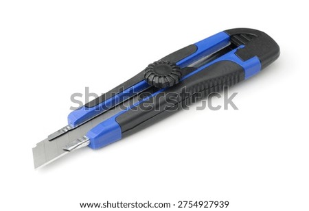 Blue retractable utility knife with replaceable blade isolated on white