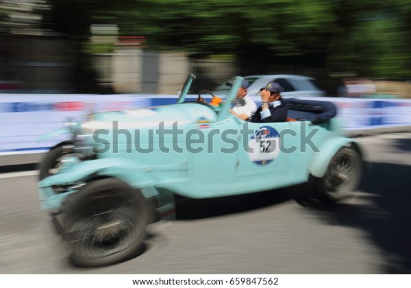 Blue retro car at speed Annual race of retro auto.\
Brescia Italy May 21 2017