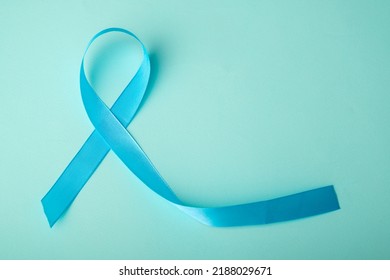 Blue ribbon on background. Prostate cancer awareness month. Blue ribbon symbol of world prostate cancer month and concept of healhcare. Copy space. - Shutterstock ID 2188029671