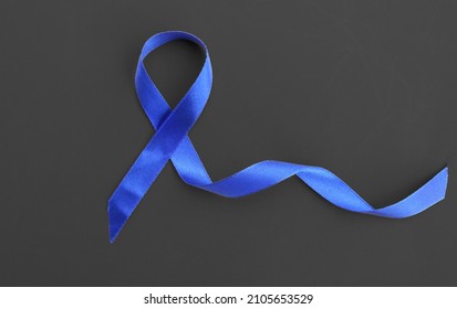 Blue Ribbon On Black Background Prostate Cancer Awareness Concept