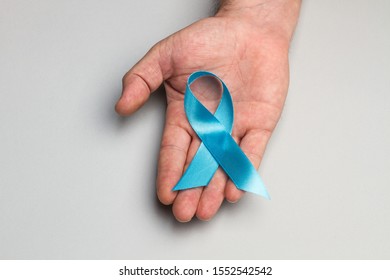 A Blue Ribbon On A Man Hand