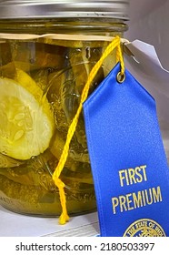 Blue Ribbon Preserved Pickles In A Canning Jar At The County Fair