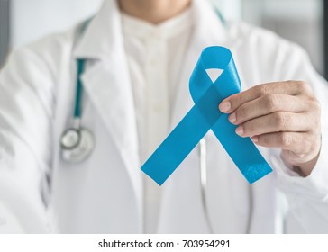Blue ribbon for prostate cancer awareness, men's health care,  guillain-barre syndrome GBS concept with symbolic bow in doctor's hand - Shutterstock ID 703954291
