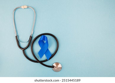 Blue ribbon with stethoscope on blue background, prostate cancer awareness month - Powered by Shutterstock