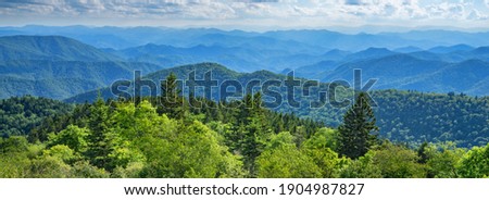 Blue Ridge Parkway summer Landscape. Beautiful summer mountain panorama.  Green mountains and layers of  hills. Near Asheville, North Carolina. Blue Ridge Parkway.USA.