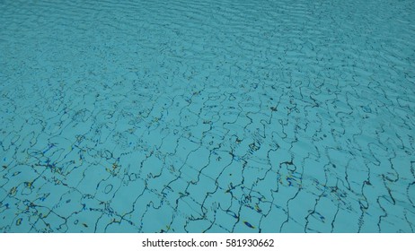 Blue ripped water in swimming pool. low light