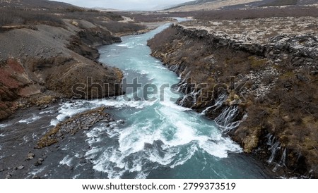 a blue river flows through a wild canyon