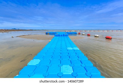 Blue Rotomolding Of Jetty Against Blue Sky