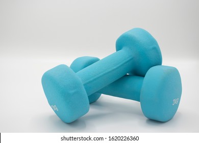 Blue Rubber Coated Dumbells Isolated In White Background