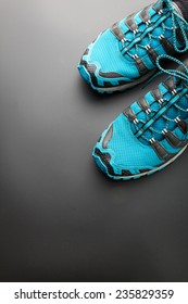 Blue Running Shoes On Grey