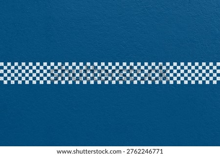 Blue running track with horizontal checkered finish line and subtle texture. Sports concept suitable for race finish, competition, goal, and success themes.