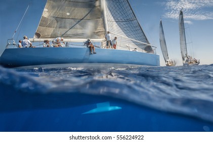 Blue Sailing Boat On The Sea With Keel Under Water