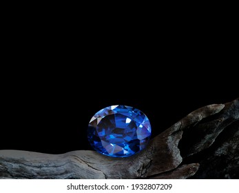 blue sapphire on old wooden with black background