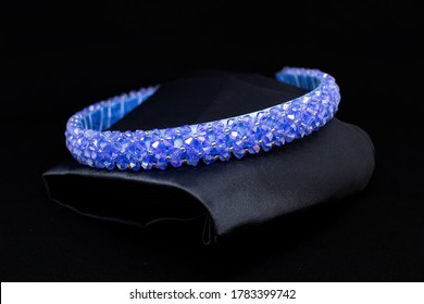 Blue Sapphire Tiara Gemstones Diamonds Hair Band On Black Background. Jewelry Display Isolated Concept