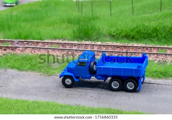 Blue\
scale truck on model train railroad layout\
road