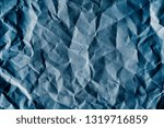 Blue scrunched paper textured background