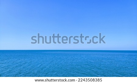 Blue sea, calm waves and blue sky in Thailand