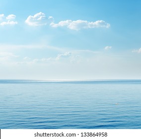 Blue Sea And Clouds On Sky