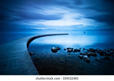 Blue Sea And Curve Jetty , Long Exposure Photography.