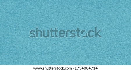 Blue sea felt fabric background. Surface of fabric texture in blue turquoise color .