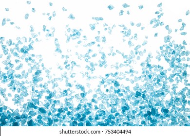 Blue sea salt crystals on white background