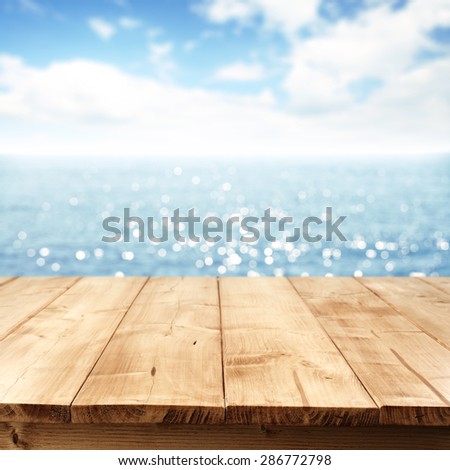blue sea blue sky and table of wood space 