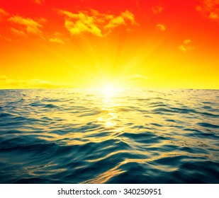 Blue sea and sun on sunset