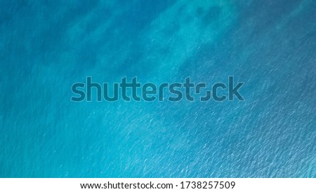 Blue sea surface from above