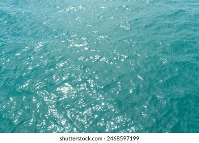 Blue sea water background and sun reflections. Aerial drone view. Waves water surface. Flight over the ocean. Aerial ocean view. Top fly over the sea. - Powered by Shutterstock