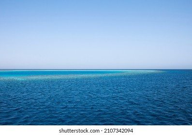 Blue Sea Water Horizon Line. Seawater Background. Blue Sea With Little Waves Texture. Seawater Surface Texture