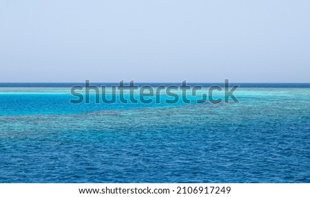 Blue sea water horizon line. Sea water background. Blue sea with little waves texture. Sea water surface texture