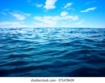 Blue sea water surface on sky - Shutterstock ID 371478439