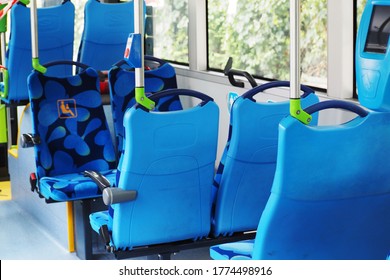 blue seats on an empty city bus in Europe