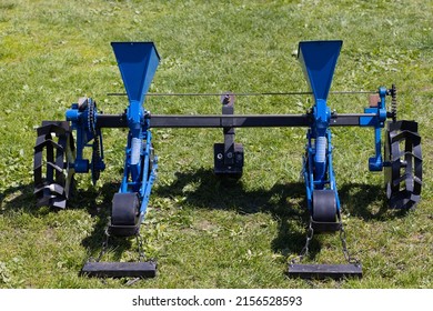  Blue Seeder For Agricultural Machinery On The Grass. High Quality Photo