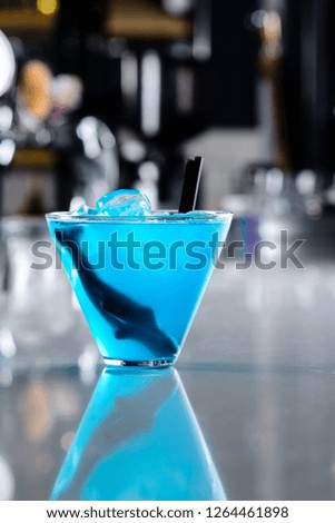 blue shark cocktail closeup on bar counter with copy space