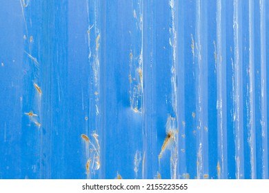 Blue Sheet Metal Wall With Grooves And Rust And Abrasion