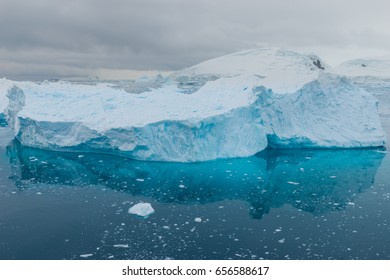 Blue shimmering beautiful iceberg in Antarctica