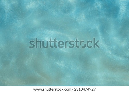 blue Shiny Abstract Background. Paints, Acrylic, Glitter in Water. blue Shiny Liquid Surface, Ripples, Waves. Foto stock © 