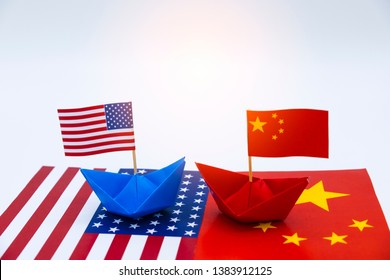 Blue ship and red ship with USA and China flags. Its is symbol for tariff trade war crisis between biggest economic country in the world.