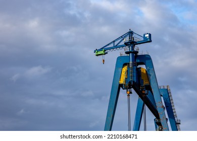 Blue Shipyard Crane In Harbor 