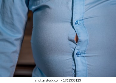 Blue Shirt Too Small To Wear By Overweight Man